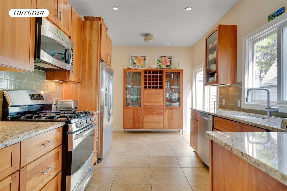 New York City Real Estate | View 23 Huckleberry Lane | Top of the line kitchen with slider to the outside patio | View 3