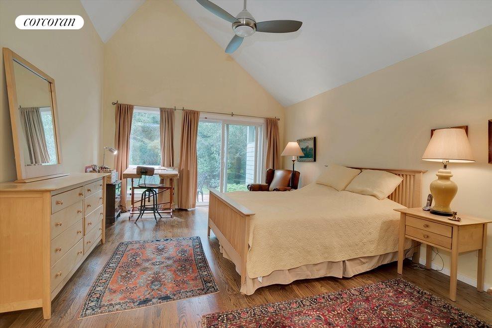 New York City Real Estate | View 23 Huckleberry Lane | Master bedroom has sliders out to a private patio | View 8
