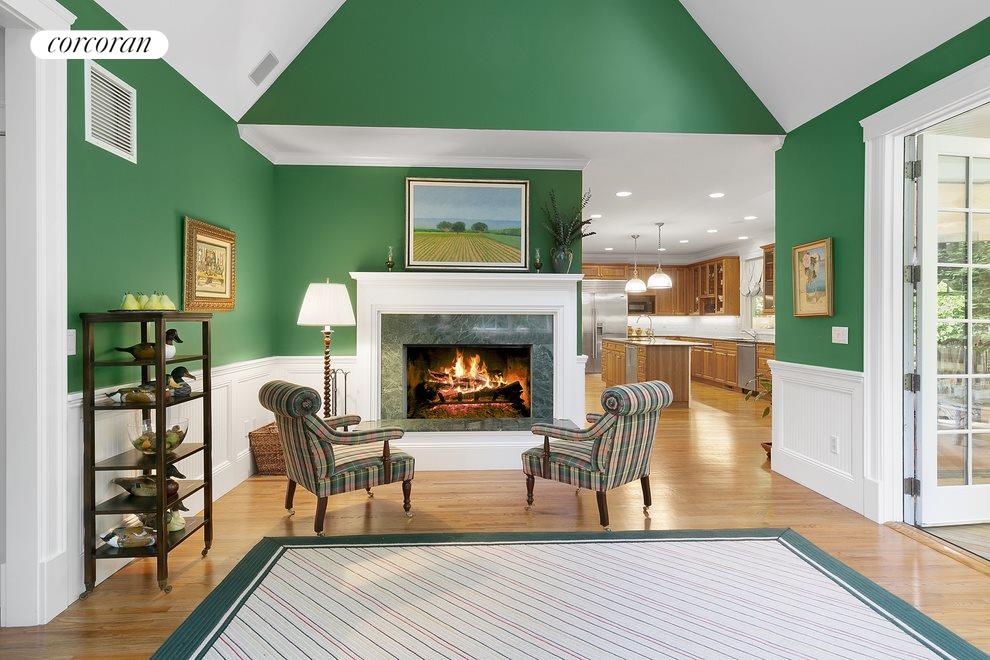 New York City Real Estate | View  | Den features wood burning fireplace (looking toward kitchen) | View 8